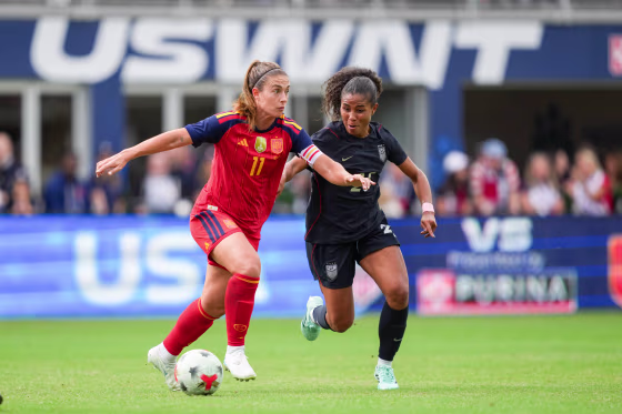 Alexia Putellas of Spain is marked by Kennedy Wesley of the United States.