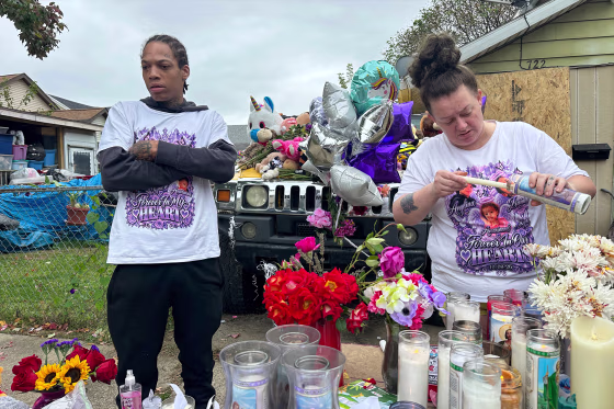Julius Windham visits a memorial outside the home where authorities say a gunman killed multiple people, including Windham's daughter, in Erie, Pa., on Sunday, Oct. 11, 2026. 