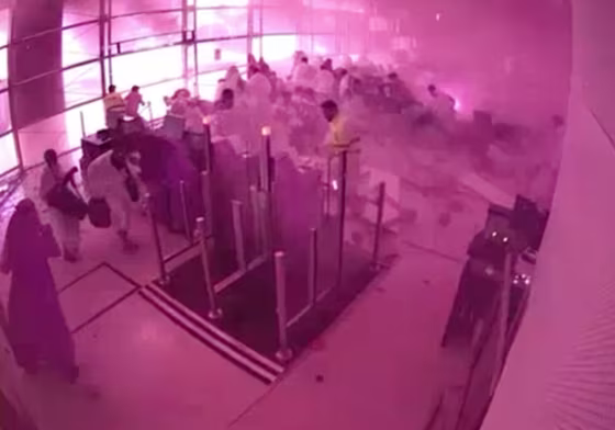 CCTV video frame released by Saudi Arabia's Media Ministry shows passengers taking cover as flames and smoke fill part of King Khalid International Airport in Riyadh, Saudi Arabia, during what authorities described as a strike at the airport on Saturday, Oct. 10, 2026.