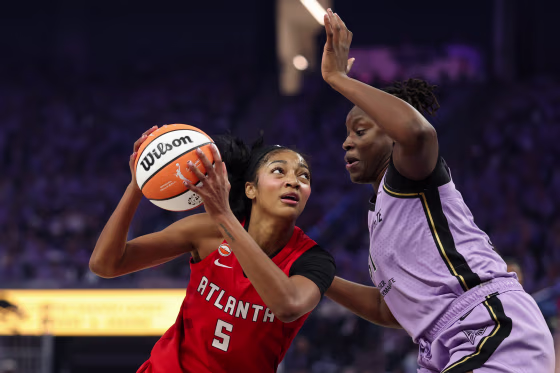 Angel Reese #5 of the Atlanta Dream looks to shoot the ball against Aminata Gueye #31 of the Golden State Valkyries.