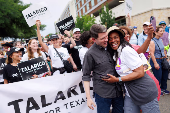 Texas State Rep. James Talarico is hugged by a supporter during a Juneteenth march in Fort Worth, on June 19, 2026.