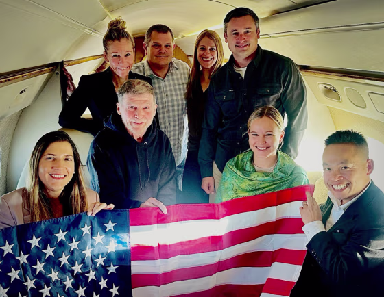 Stephen Hubbard aboard an aircraft with several others as he returns from Russia on Oct. 21, 2026.