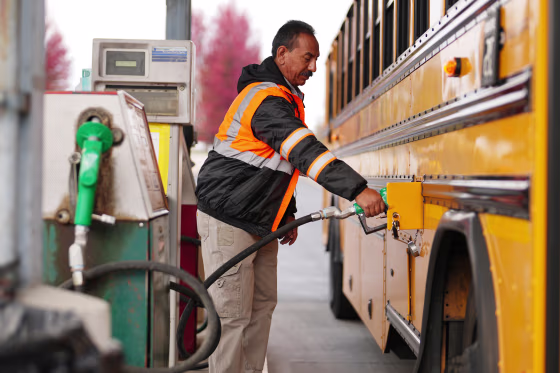 School bus driver Ben Torres fills his bus with diesel at the transportation depot in Yakima, Wash. Heading into the midterm elections, high diesel prices are affecting school districts, particularly rural ones that rely on long bus routes.