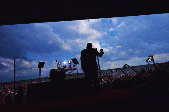 Donald Trump raises his fist to the crowd at a campaign stop.