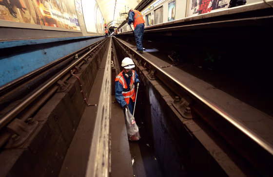 Cleaners, known as fluffers, work in Highbury and Islington station in London March 30, 2012.
