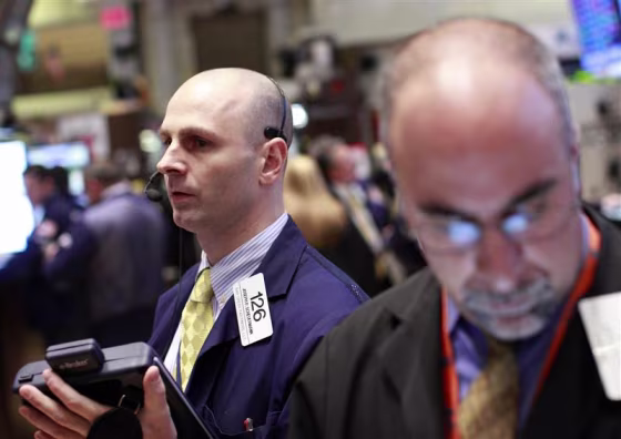 Traders work on the floor of the New York Stock Exchange.