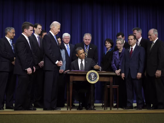 President Obama signs the Stop Trading on Congressional Knowledge Act on April 4.. The act ensures that members of Congress are subject to the same insider trading laws as other Americans.