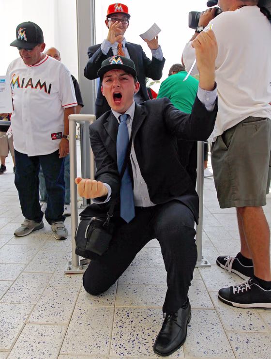 A fan celebrates as he enters the stadium for Opening Day between the Miami Marlins and the St. Louis Cardinals at Marlins Park on April 4, 2012 in Miami, Florida.