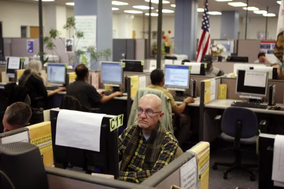 Michael Johnson looks for warehouse work online at the Employment Development Department of California service office in San Francisco in this file photo.