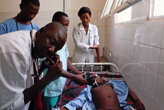 A doctor tries to save a young boy suffering with malaria at the Simao Mendes hospital in Bissau, West Africa on April 25. All image captured by EPA's Andre Kosters on April 25.