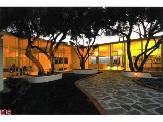The glass-walled home cost a fortune to build in the 1950s.
