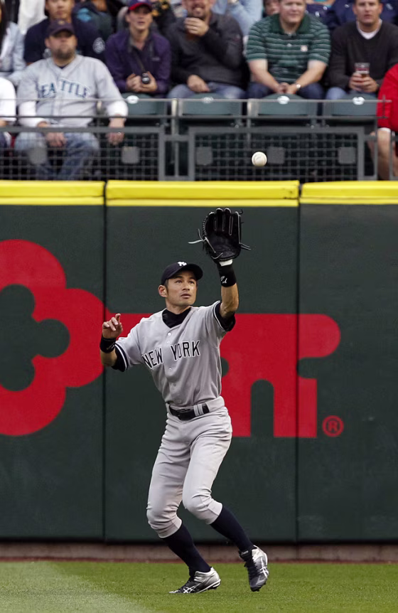 New York Yankees right fielder Ichiro Suzuki catches a fly ball from Seattle Mariners' Kyle Seager in the first inning of a baseball game Monday, July 23, 2012, in Seattle.