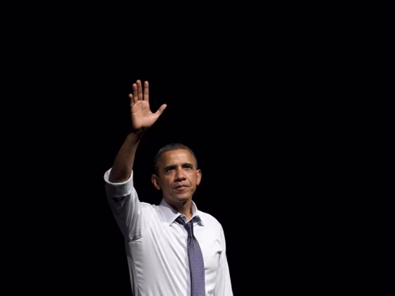 President Barack Obama waves after speaking during a campaign event at the Fox Theatre in Oakland, California, on July 23, 2012.