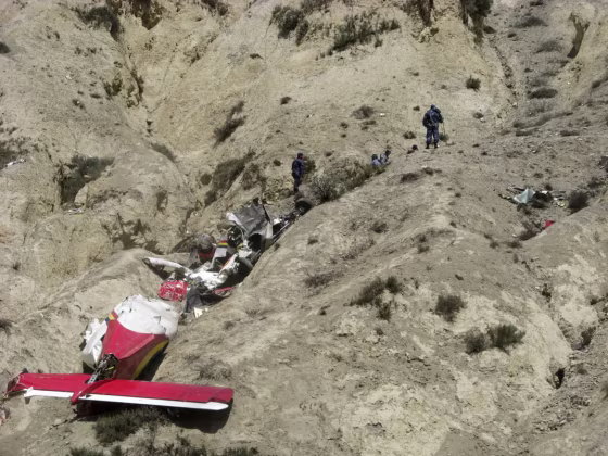 Onlookers and rescuers are seen near the wreckage of an Agni Air Dornier Do 228 aircraft at the crash site in Jomsom, west of Kathmandu, on May 14, 2012. A small plane crashed near a treacherous high-altitude airport in northern Nepal May 14, killing 15 people while six others miraculously survived, police said. The aircraft belonging to local carrier Agni Air ploughed into the ground just outside Jomsom airport, a gateway to the Annapurna mountain range, shortly after the pilot reported a fault.