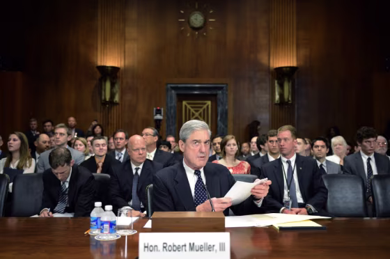 FBI Director Robert Muller (center) testifies before the Senate Judiciary Committee's hearing on oversight of the Federal Bureau of Investigation on Capitol Hill in Washington, DC, May 16. Muller responded to questions on the renewal of the Foreign Intelligence Surveillance Act and the accuracy of FBI forensic analysis of hair and fiber evidence that has recently been called into question.