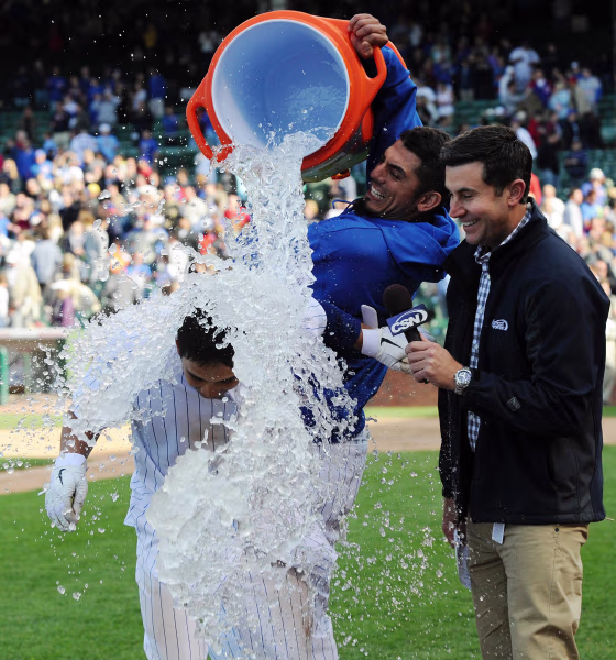 Darwin Barney of the Chicago Cubs gets ice water dumped on him by Matt Garza after hitting a walk off two run homer in the ninth inning against the San Diego Padres on May 30. The Cubs defeated the San Diego Padres 8-6.