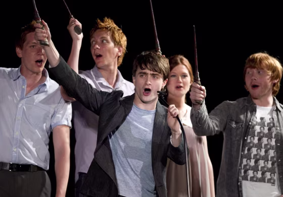 Daniel Radcliffe, center, and members of the cast of