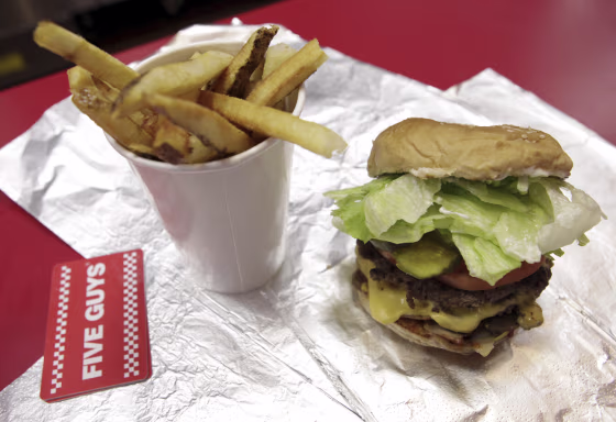 A cheeseburger and large fries from a Five Guys restaurant is the kind of meal that's taking a bite out of the popularity of the big boys in the burger biz.