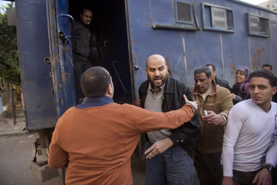 Policemen detain a Muslim Brotherhood supporter after a demonstration in Cairo's eastern Nasr City district on Friday.