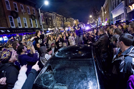 Baltimore Ravens fans celebrate in the streets in downtown Baltimore after their team won the NFL football Super Bowl against the San Francisco 49ers on Feb. 3, 2013.