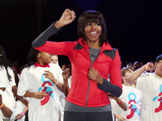 First lady Michelle Obama dances with school children during a debut of a school exercise program on Feb. 28 in Chicago.