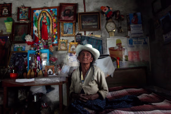 Refugio, 82, poses for a photograph inside her house in Zitlaltepec, Mexico, July 26.