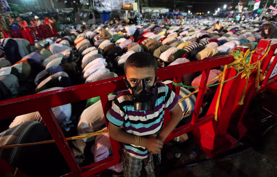 A boy stands guard during a Muslim Brotherhood protest near the Rabaa al-Adawiya mosque in Cairo Sunday.