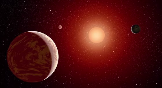 This artist's concept illustrates a young, red dwarf star surrounded by three planets. Such stars are dimmer and smaller than yellow stars such as our sun.