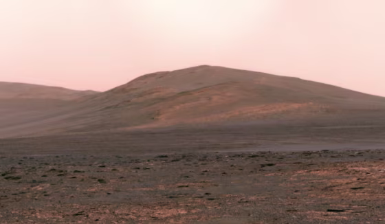 This panorama from NASA's Opportunity rover, made on June 1, shows Solander Point rising up on the Martian horizon. Mission managers plan to get the solar-powered rover to a north-facing slope on Solander Point by August, so that it can shelter there during the Martian winter.