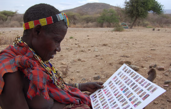 A woman from Tanzania's Hadzabe tribe studies a social-networking chart.