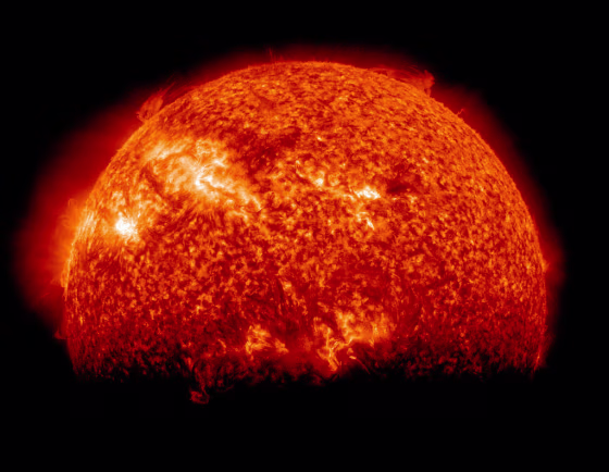 A March 29 image from NASA's Solar Dynamics Observatory captures a "space eclipse," in which Earth's disk obscures part of the sun.