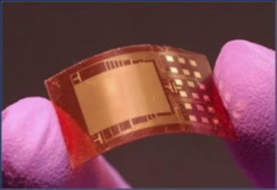 When the nanogenerator chip is flexed between the fingers, it puts out enough power to light up an LED bulb and an LCD display.