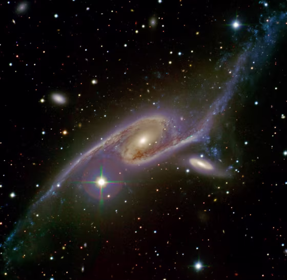 The galaxy NGC 6872 (left) and its companion IC 4970 (right) are locked in a tango as they gravitationally interact.