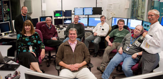 Researchers at the Thomas Jefferson National Accelerator Facility relax after creating a new color of laser: