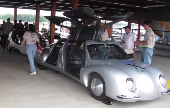 Illuminati Motor Works' Seven has its gull-wing doors open while parked at the Michigan International Speedway.