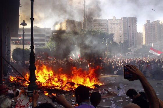 Opponents of Egyptian President Mohamed Morsi burn a Freedom and Justice Party office Friday in Alexandria, Egypt.
