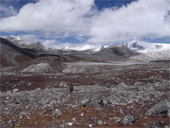 A hiker treks through Rinchen Zoe plateau in the Bhutanese Himalayas.