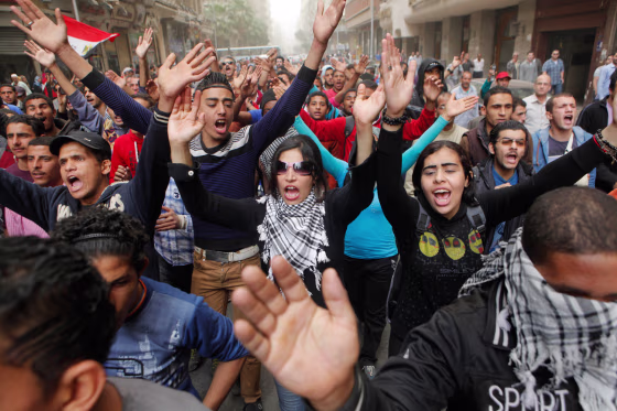 Egyptians shout anti-Muslim Brotherhood slogans during a march from downtown to the main Brotherhood headquarters in the hilltop neighborhood of Muqat...