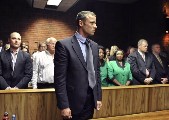 Olympian Oscar Pistorius stands following his bail hearing in Pretoria, South Africa, on Feb. 19.
