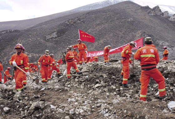 Rescuers search for survivors at the site of a landslide in a mining area in Maizhokunggar County, Tibet Autonomous Region, March 30, 2013.