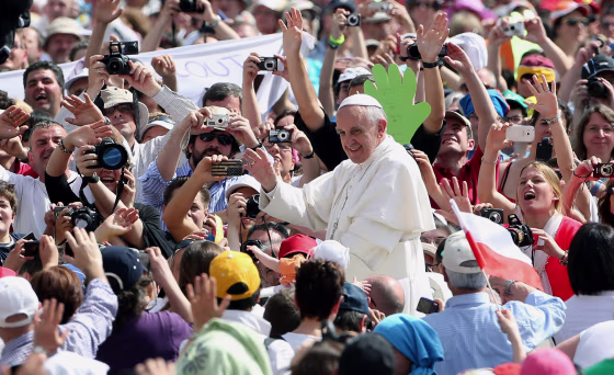 Pope Francis waves to faithful as he arrives in St. Peter's Square on May 1, 2013 in Vatican City, Vatican. Marking the feast of St Joseph the Worker and World Labor Day, the Pontiff launched an urgent appeal to Christians and men and women of goodwill worldwide to take decisive steps to end slave labor.