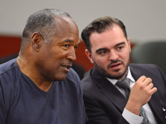 O.J. Simpson, left, confers with defense team member Dustin Marcello during an evidentiary hearing in Clark County District Court in Las Vegas on Tuesday.