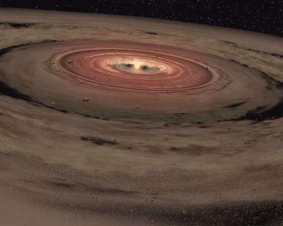 This artist's illustration shows a brown dwarf with a disk of planet-forming material around it. Brown dwarfs are bodies without enough mass to ignite nuclear fusion and become stars.