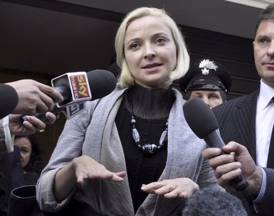 Domnica Cemortan leaves the converted Teatro Moderno theater after testifying in a hearing in the trial of Captain Francesco Schettino, in Grosseto, Italy, on Tuesday.