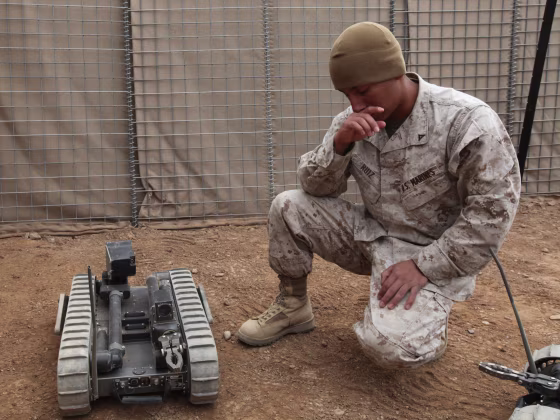 U.S. Marine Corps Lance Cpl. Alfredo Ruiz, assigned to 2nd Combat Engineer Battalion, 2nd Marine Division, briefs fellow Marines and U.S. Sailors on t...