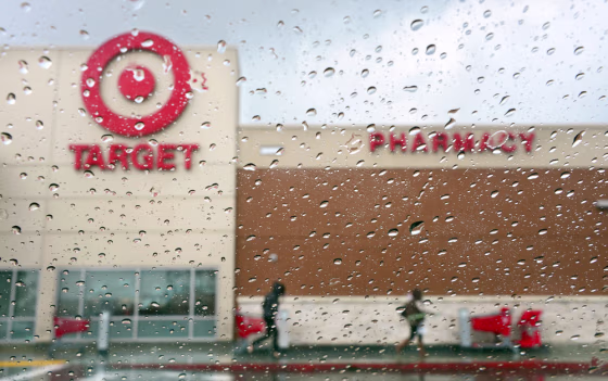(FILES) A couple of shoppers leave a Target store on a rainy afternoon in Alhambra, California in this December19, 2013, file photo. Target said on Ja...