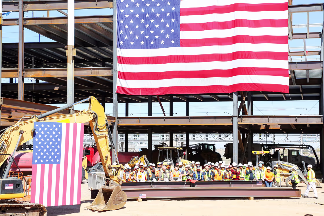 Workers wait at Intel’s Ocotillo Campus in Chandler, Ariz., to greet President Joe Biden.