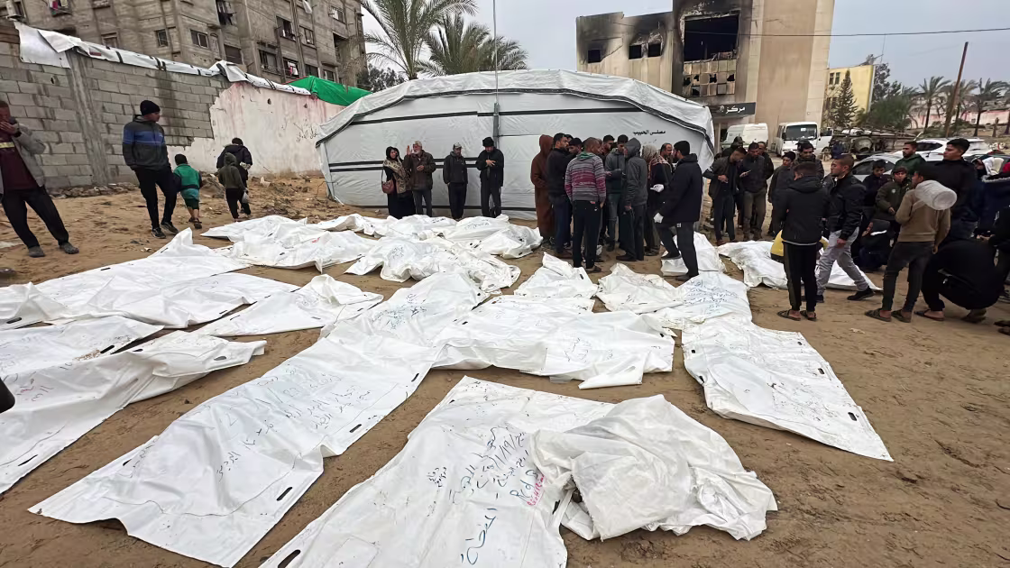 Body bags carrying the remains of people recovered from the rubble of destroyed buildings, lie on the ground outside Nasser Hospital in Khan Younis on Thursday.