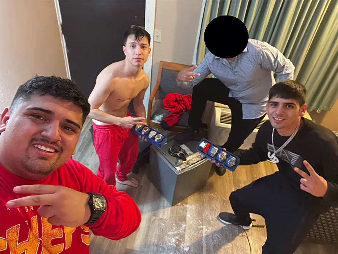 Criminals pose while burglarizing Bobby Ports' home