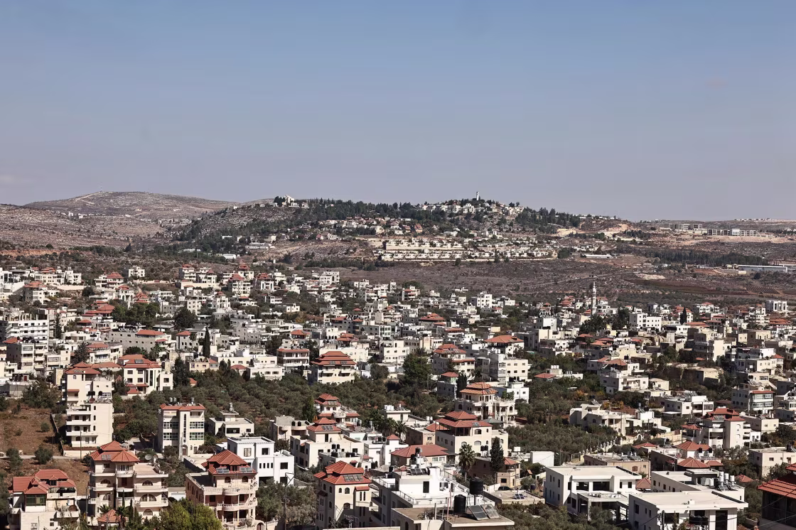 The Palestinian village of Turmus Ayya and the Israeli settlement of Shilo, background, in 2024.